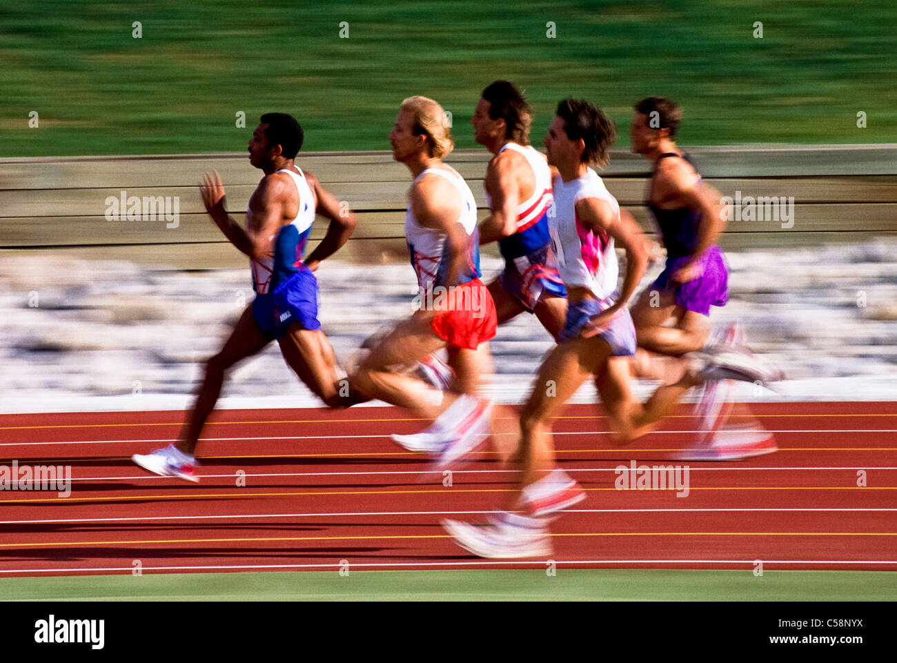 Male runners competing in a track race Stock Photo Alamy