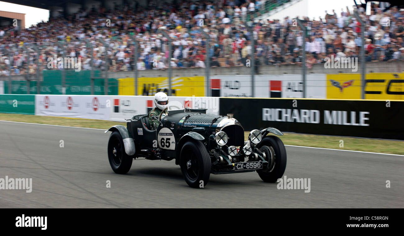 An old classic car speeds round the track. Le Mans Classic Car Race. France Stock Photo Alamy