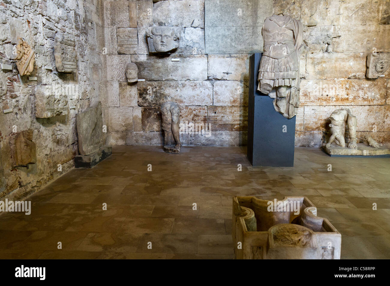 Antiquities on display within the Temple of Augustus at Pula, Croatia. Stock Photo
