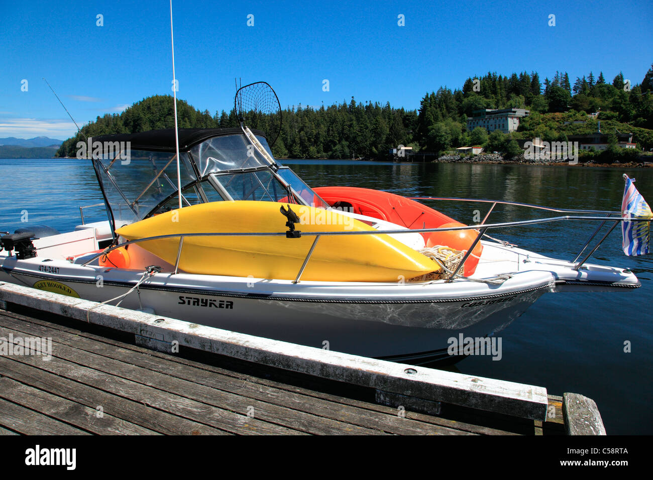 Sport fishing boat with kayaks on top hires stock photography and