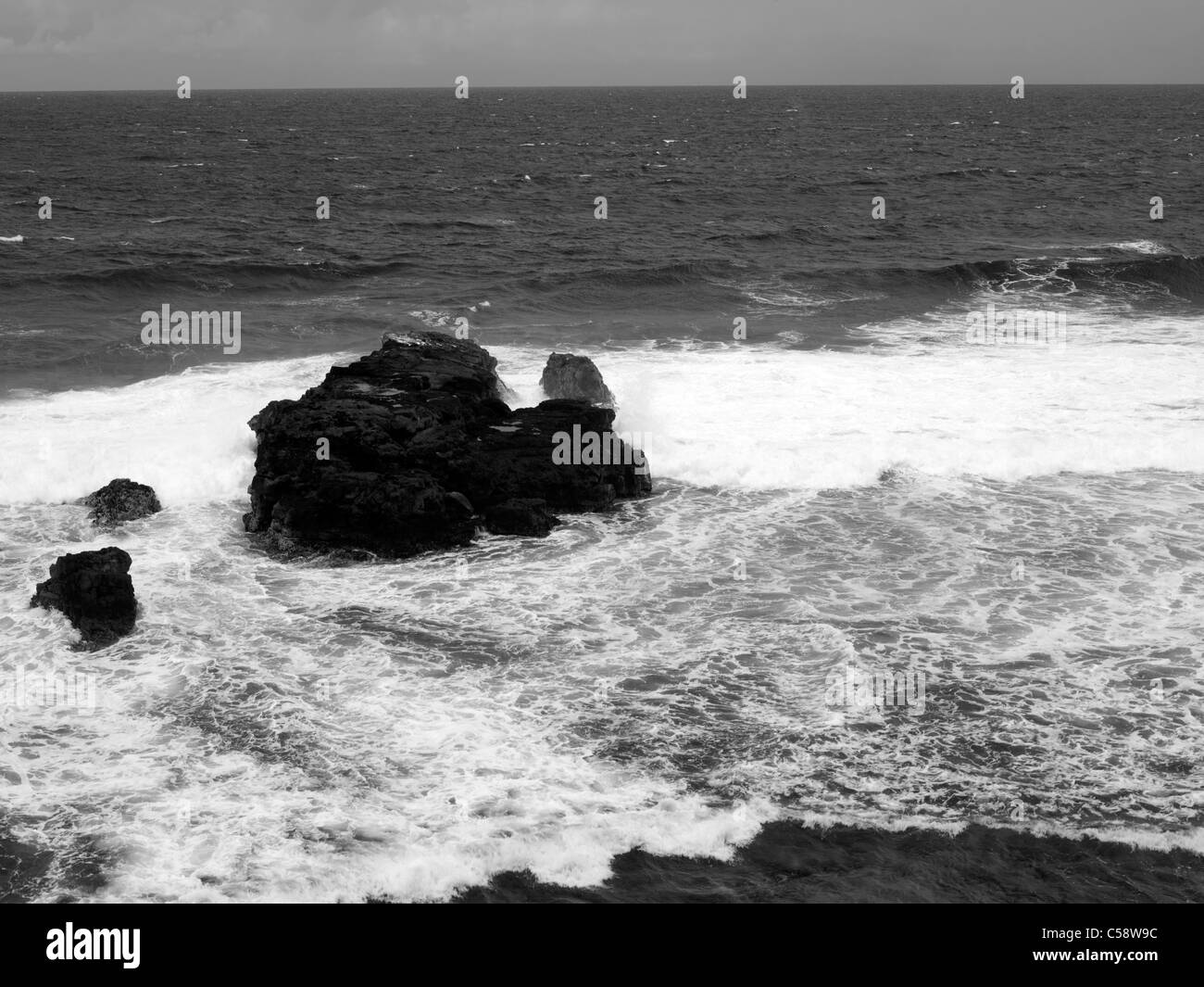 Mauritius Sea Crashing Around Rocks Stock Photo