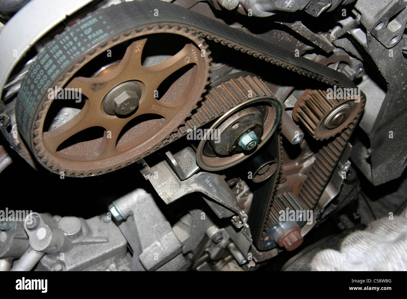 Cover removed showing a VW car Timing Belt Mechanism Stock Photo