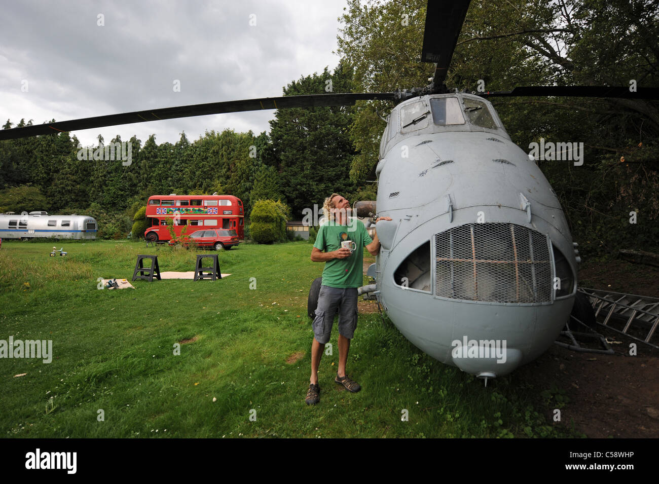 Tim Johnson bought an old Westland Search and Rescue helicopter which he is converting into a holiday home to rent out at his Blackberry Wood campsite Stock Photo