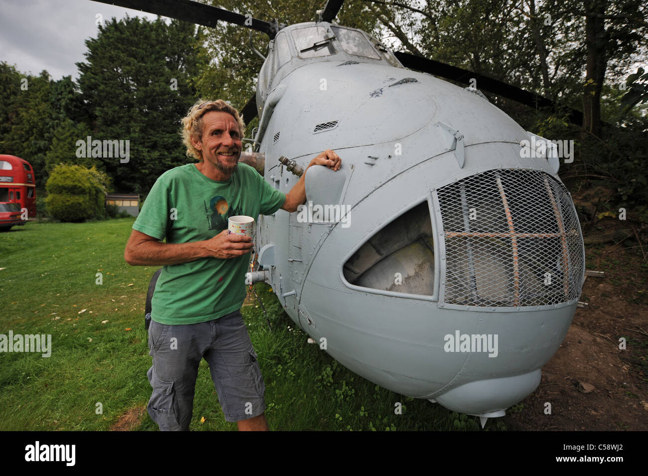 Tim Johnson bought an old Westland Search and Rescue helicopter which he is converting into a holiday home to rent out at his Blackberry Wood campsite Stock Photo