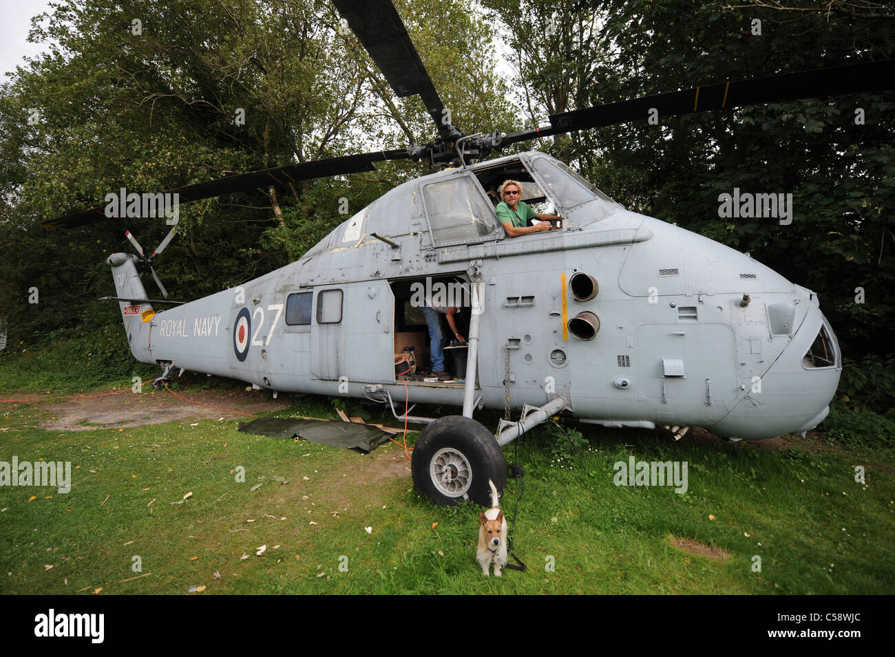 Tim Johnson bought an old Westland Search and Rescue helicopter which he is converting into a holiday home to rent out at his Blackberry Wood campsite Stock Photo