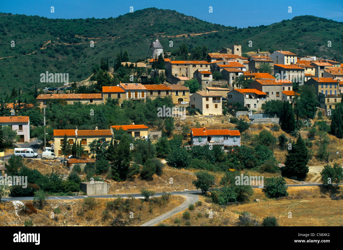 Cucugnan France Aude Languedoc-Roussillon Overview Of Village With The Windmill Of Omer Stock Photo