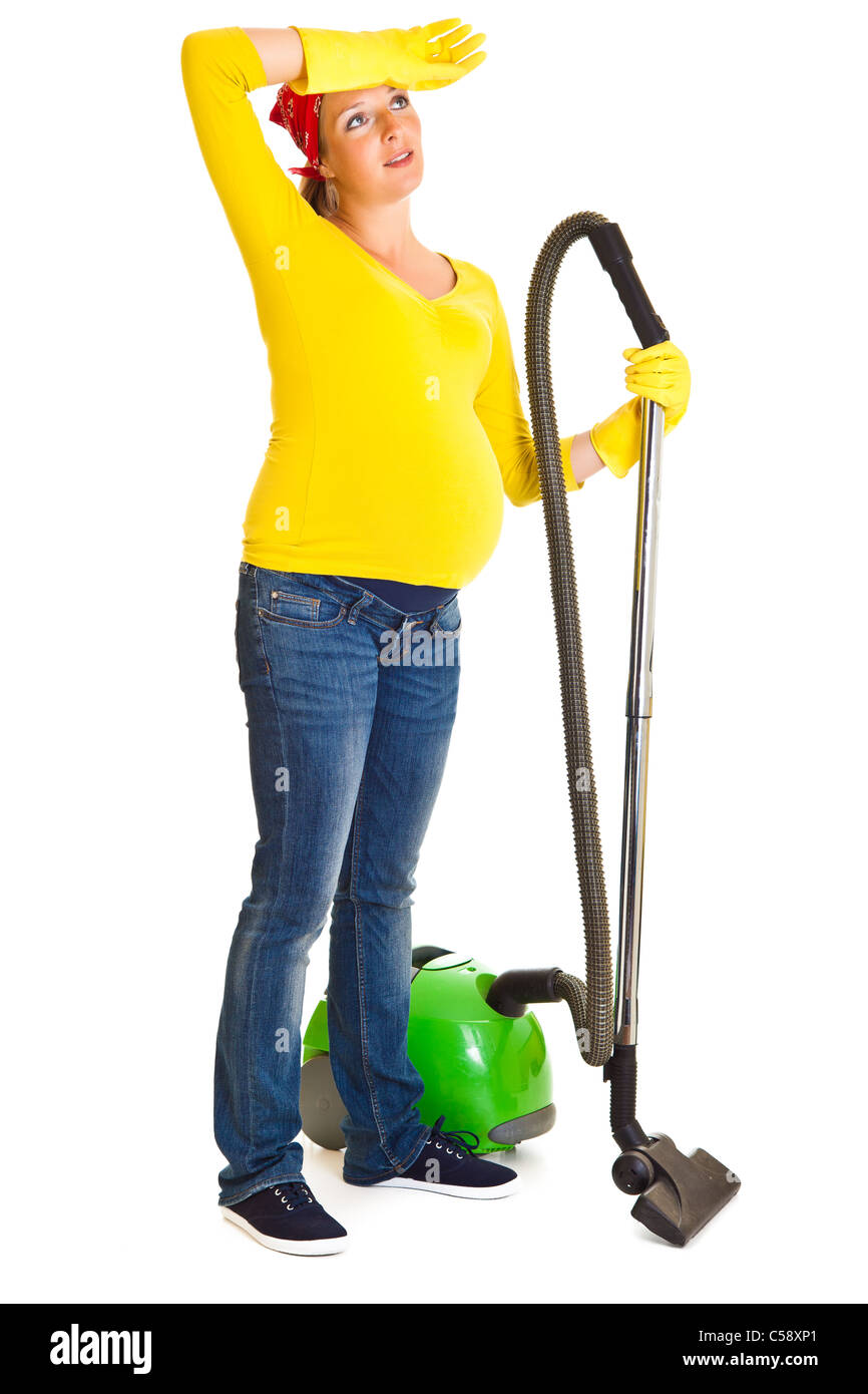 Pregnant woman clean with vacuum cleaner isolated on white Stock Photo