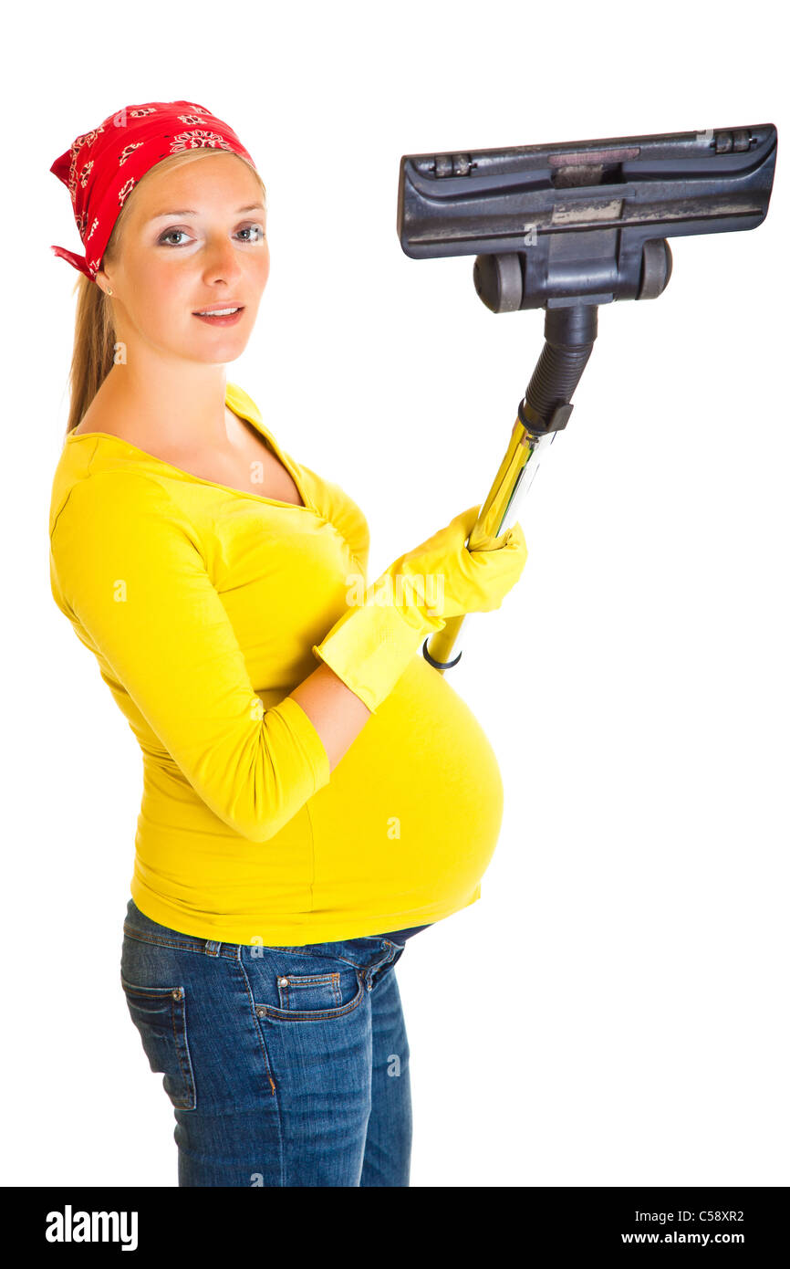 Pregnant woman clean with vacuum cleaner isolated on white Stock Photo