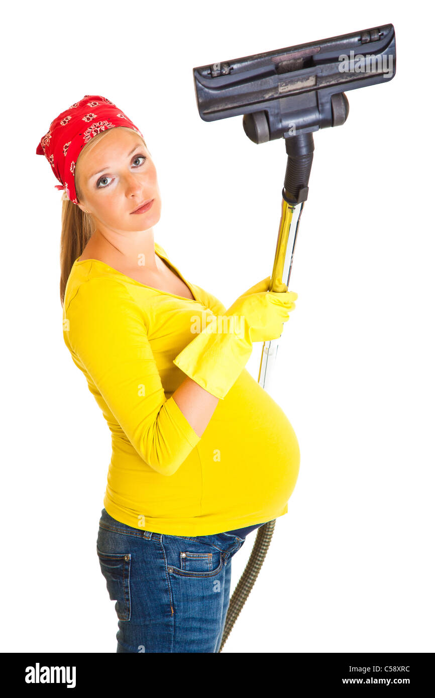 Pregnant woman clean with vacuum cleaner isolated on white Stock Photo