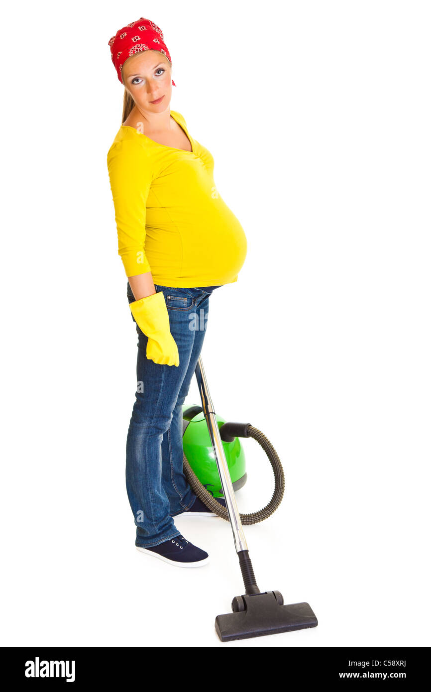 Pregnant woman clean with vacuum cleaner isolated on white Stock Photo