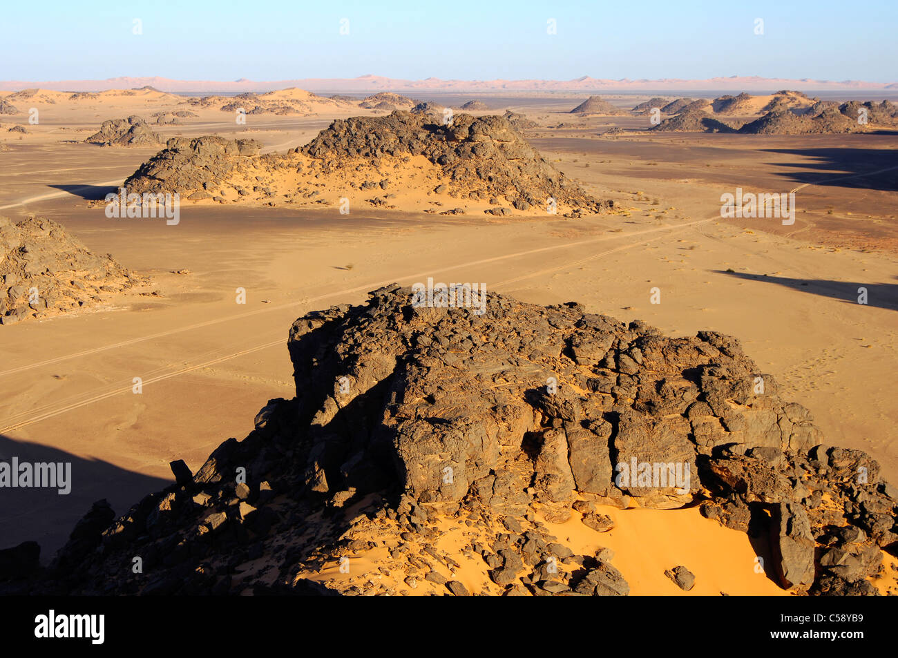 Desertscape with eroded rock hills in the Acacus Mountains, Sahara desert, Libya Stock Photo
