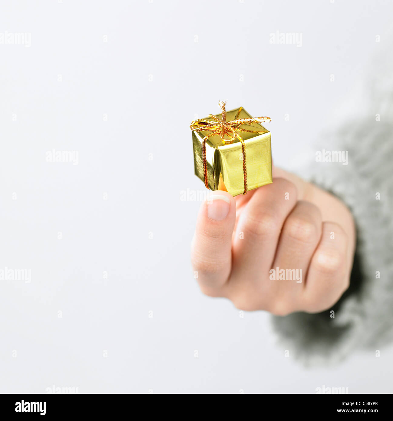 Close-up of hand with gift box Stock Photo