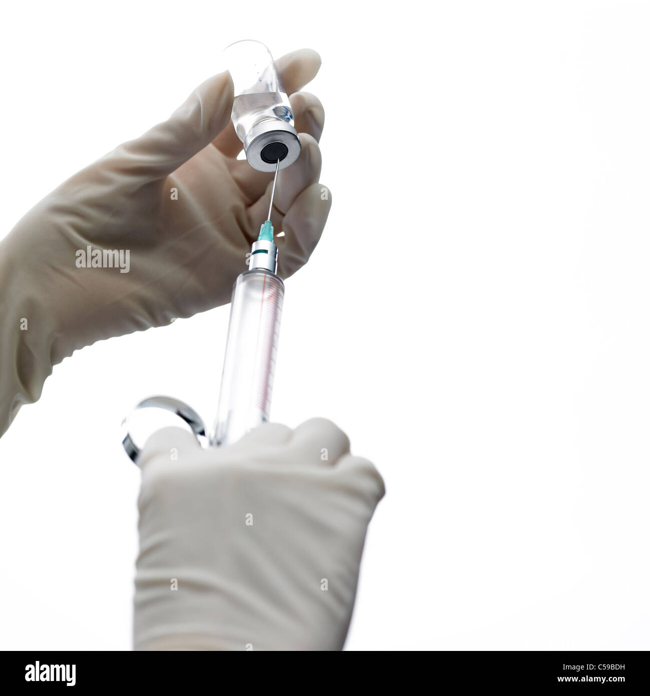 Close-up of person Filling syringe Stock Photo