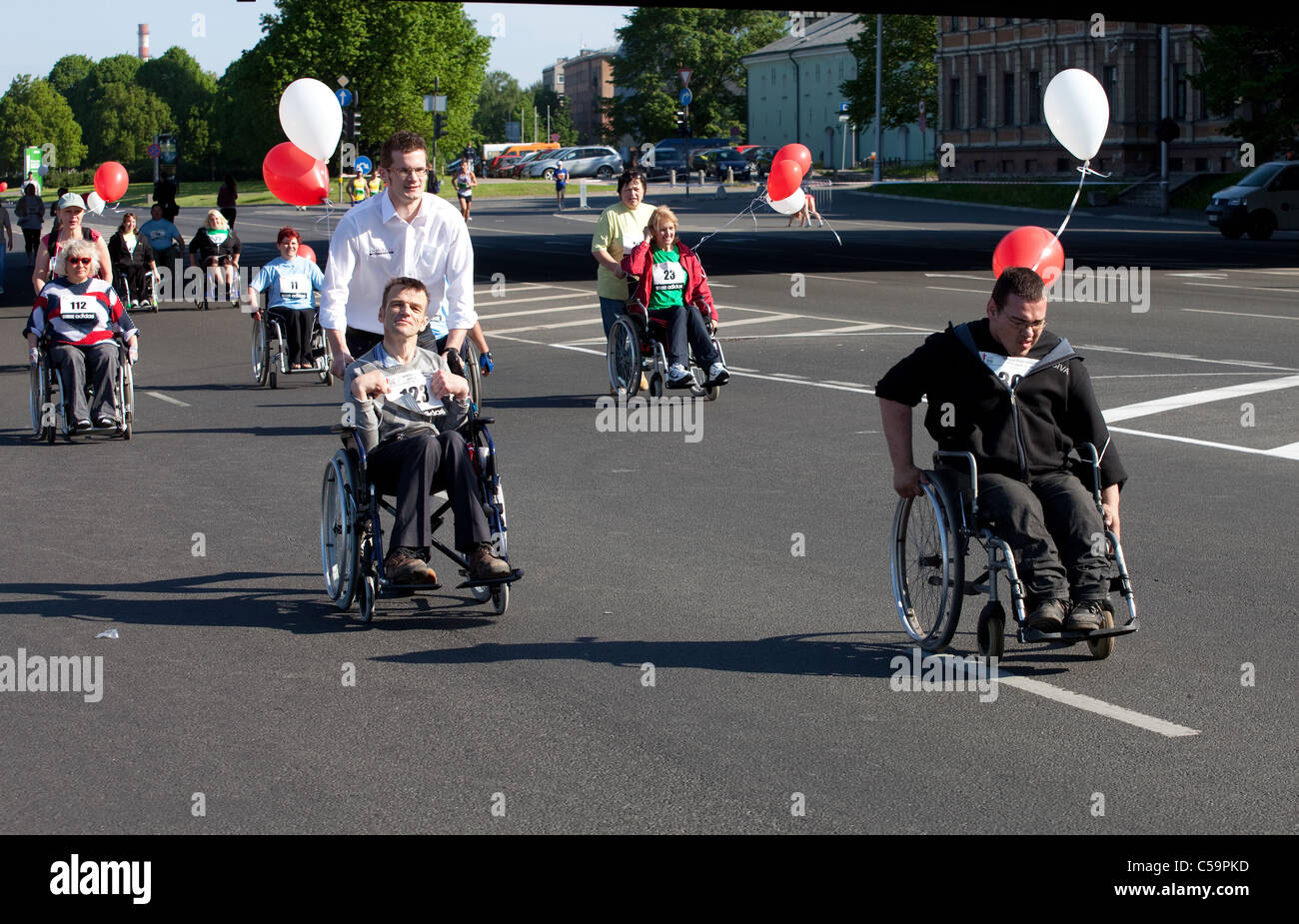 RIGA, LATVIA - MAY 23: Disabled people participate in the Riga International Marathon in May 23, 2010, Riga. Stock Photo