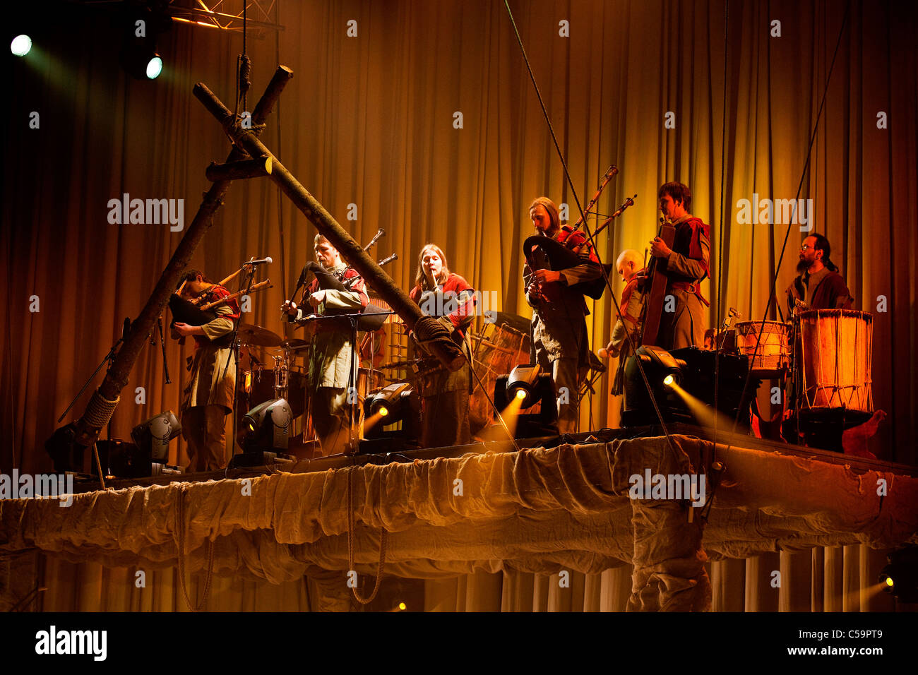 RIGA - JANUARY 16: Latvian Bagpipes and drum music group Auli playing in dance performence. Riga, Latvia, January 16, 2010 Stock Photo