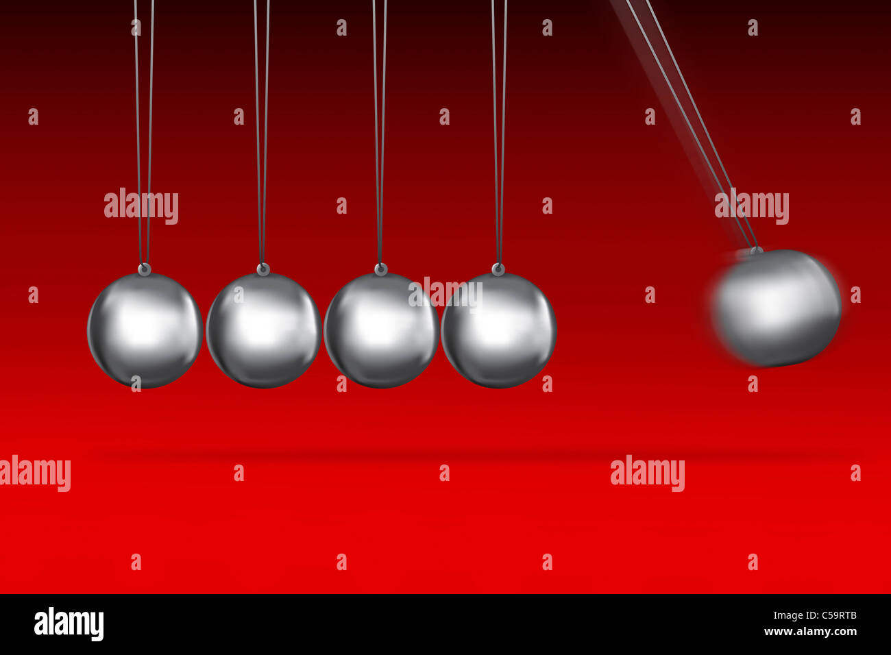 silver balls hanging and moving from newtons cradle on red background