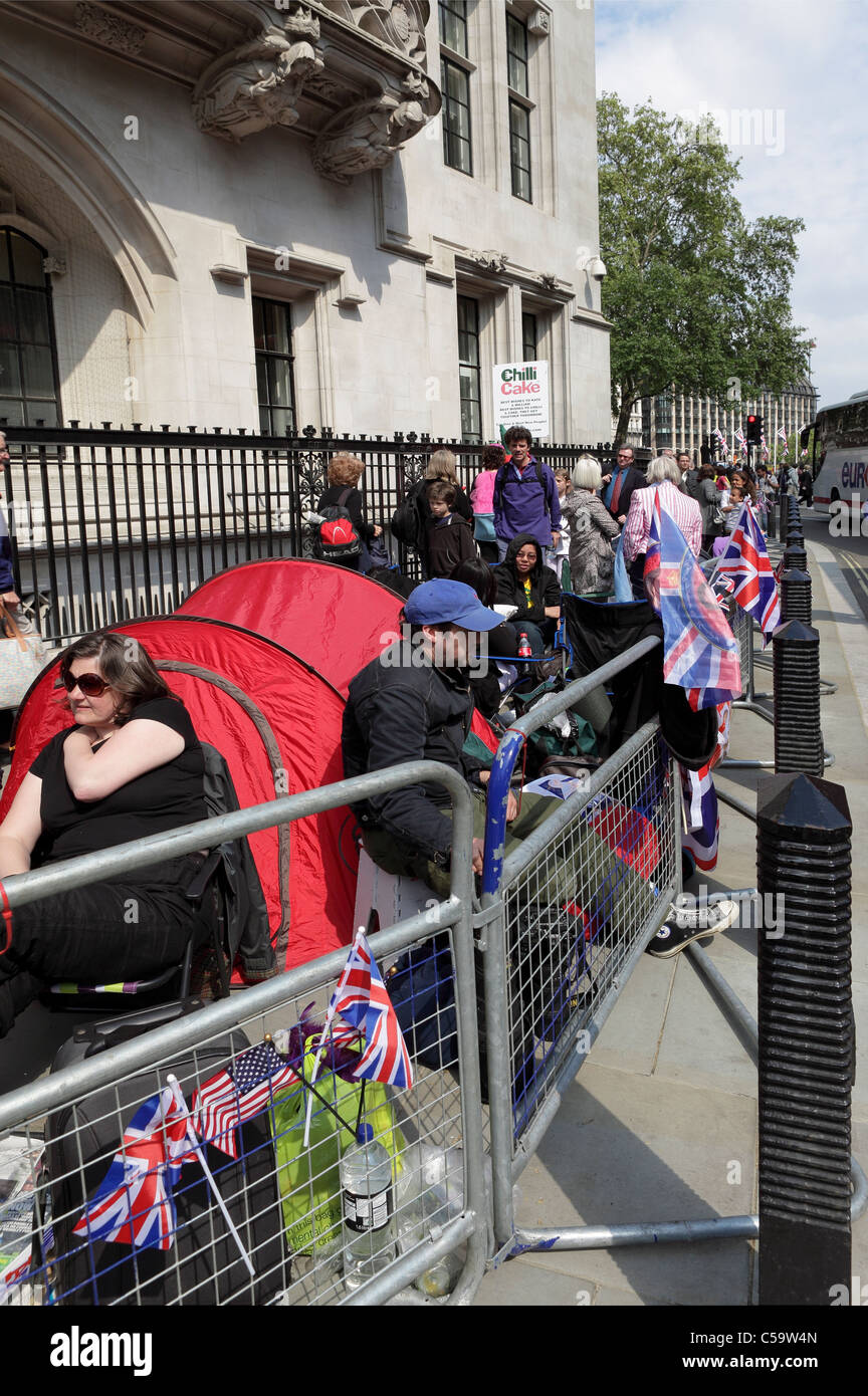 THE ROYAL WEDDING 2011, camped out all along Broad Sanctuary opposite Westminster Abbey loyal fans on the eve of the big day. Stock Photo