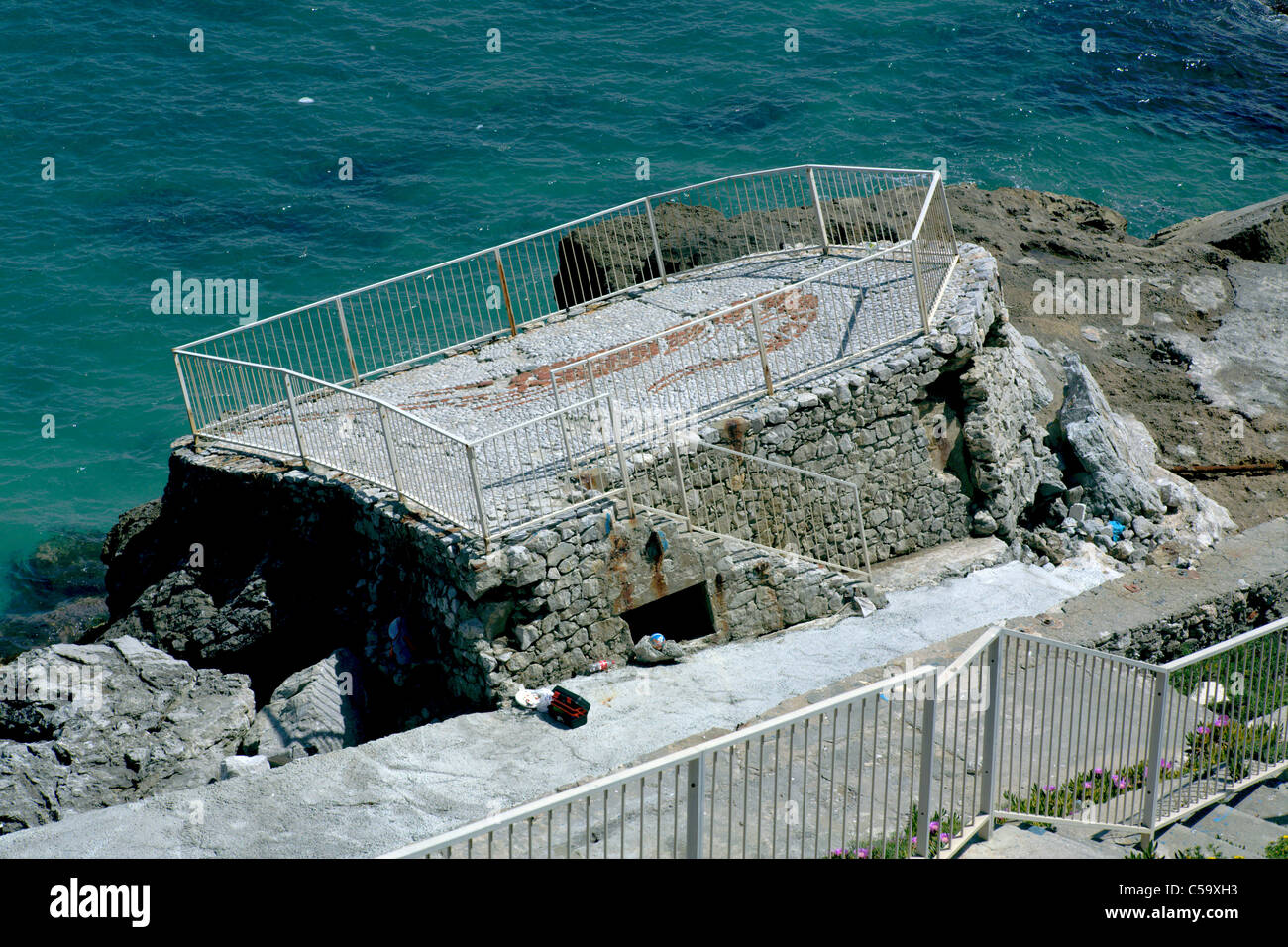 Collapsing concrete sea wall Gibraltar Stock Photo