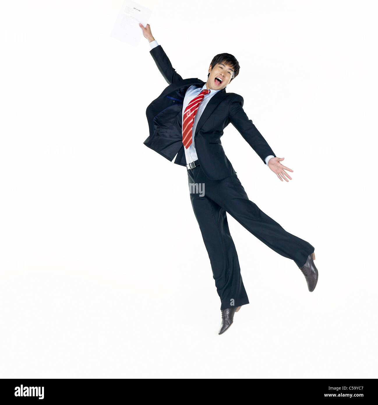 Portrait of businessman jumping Stock Photo