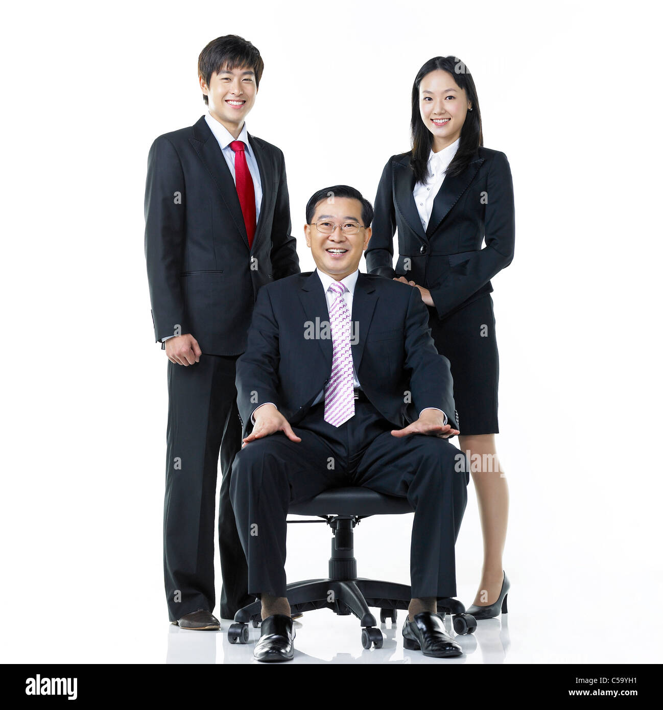 Portrait of businesspeople standing Stock Photo - Alamy