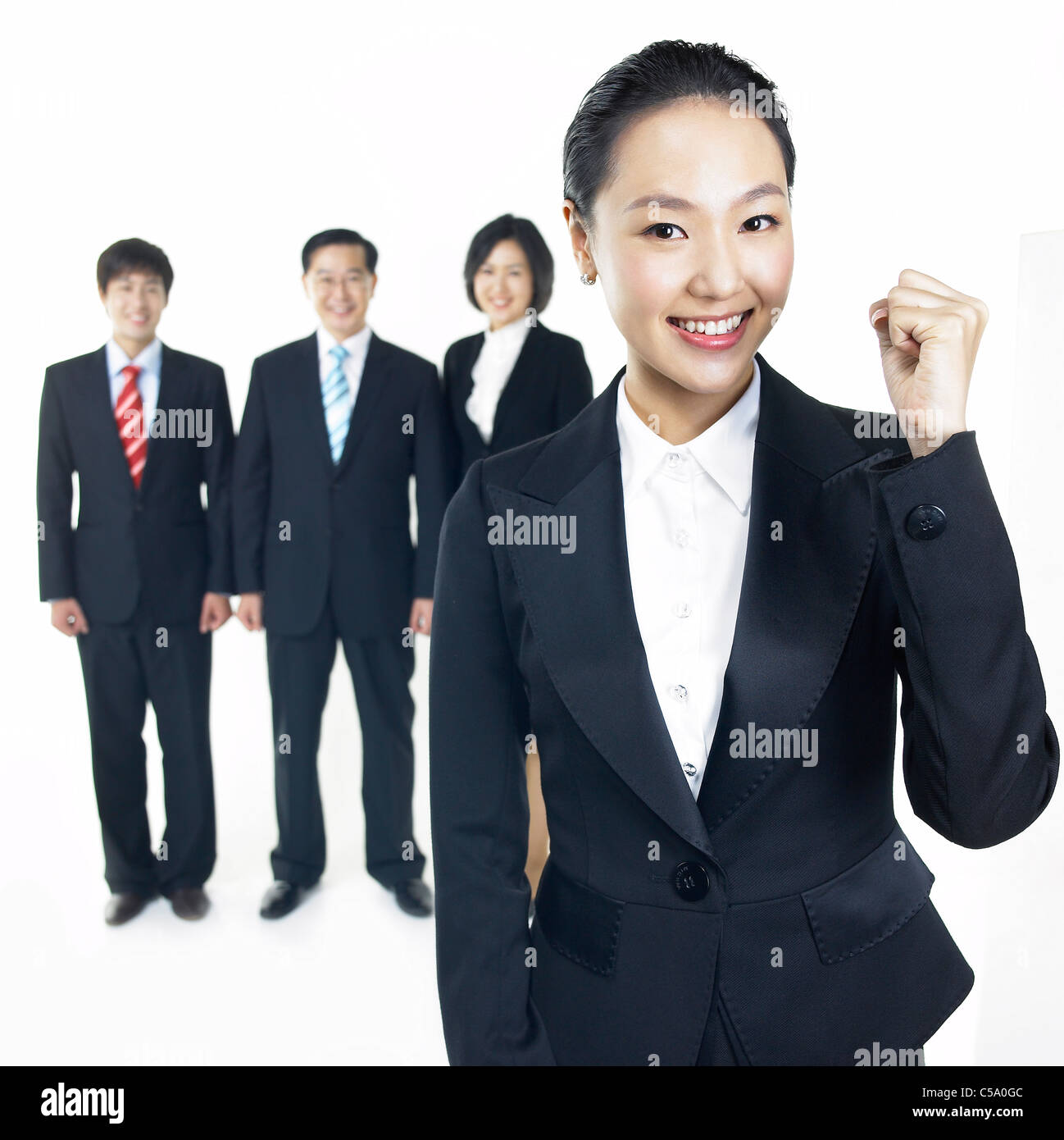 Portrait of businesspeople standing Stock Photo - Alamy