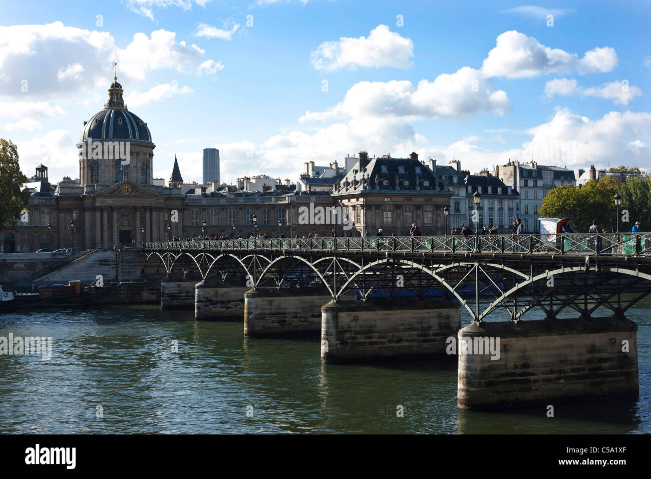 Pont des Arts pedestrian bridge over the river Seine with the French institute behind it. Paris. France Stock Photo
