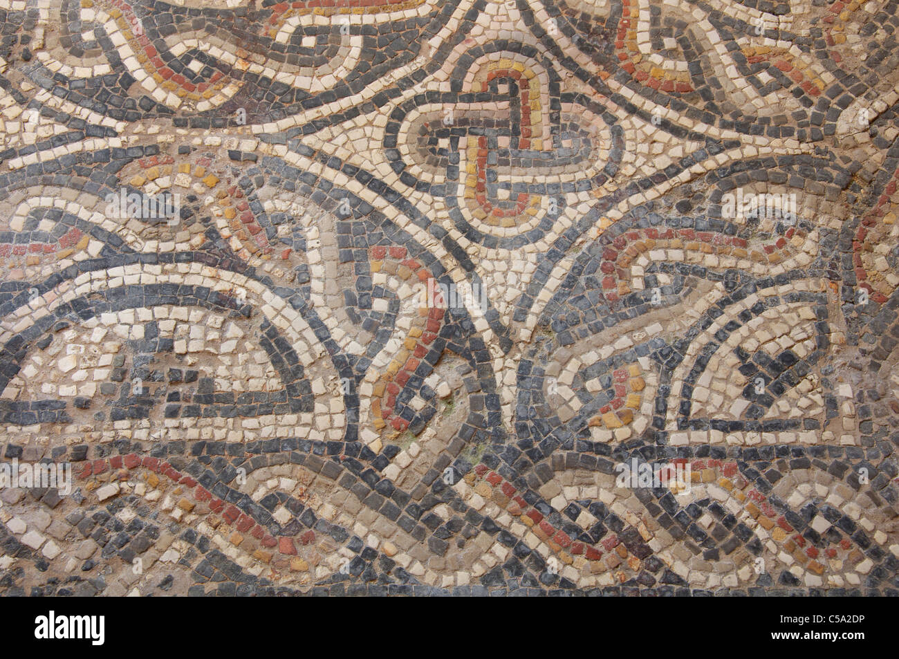 Detail of a Roman mosaic floor in the preserved remains of a 4th century Romano-British townhouse in Dorchester. Dorset, England, United Kingdom. Stock Photo