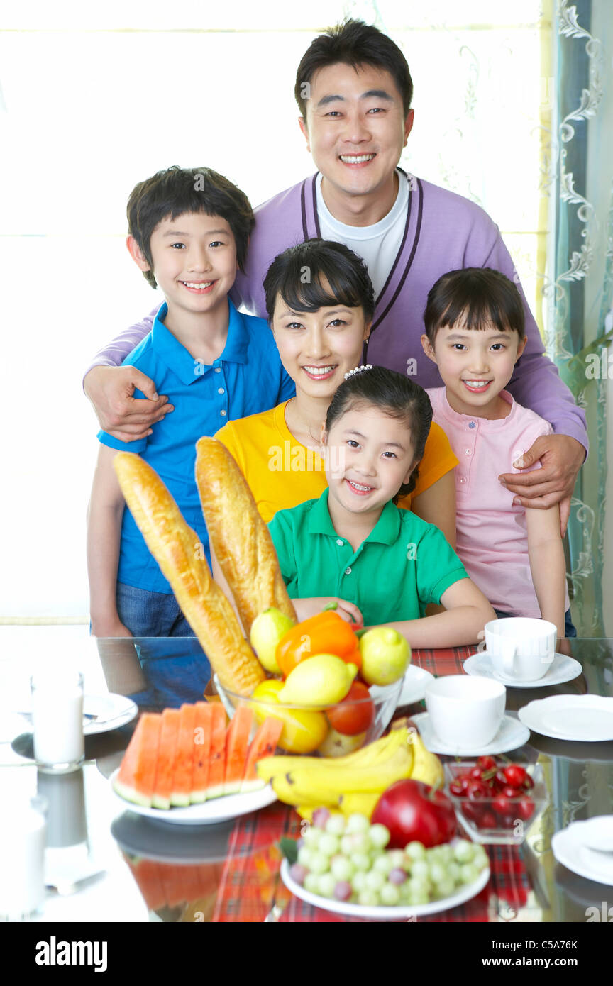 Portrait of family at breakfast table Stock Photo - Alamy