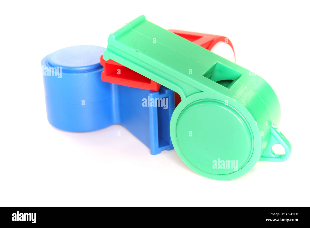Colorful Trill whistles on a white background Stock Photo Alamy