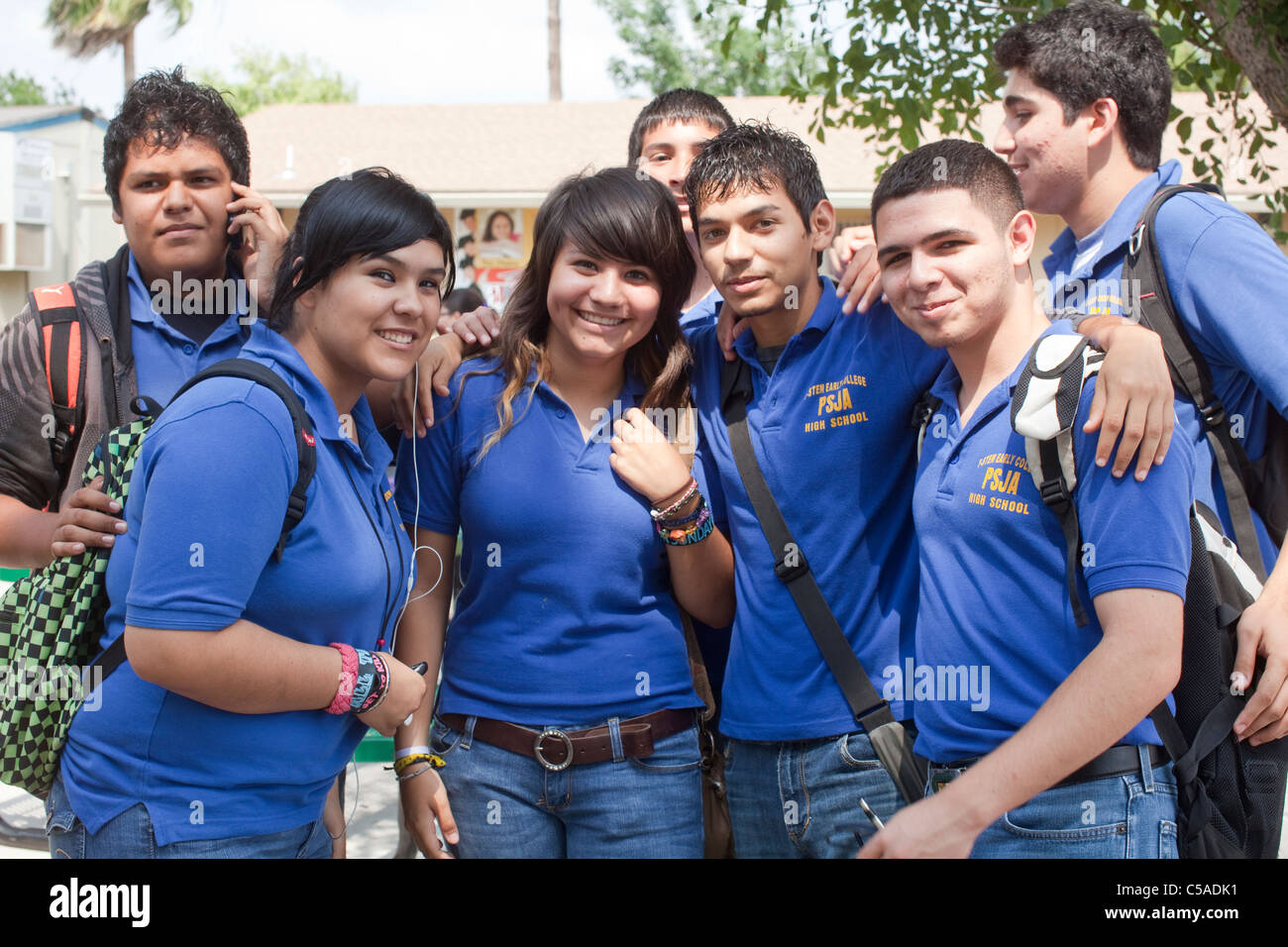 Group of Hispanic high school students pose outside their school in the Pharr-San Juan-Alamo School District in South Texas Stock Photo