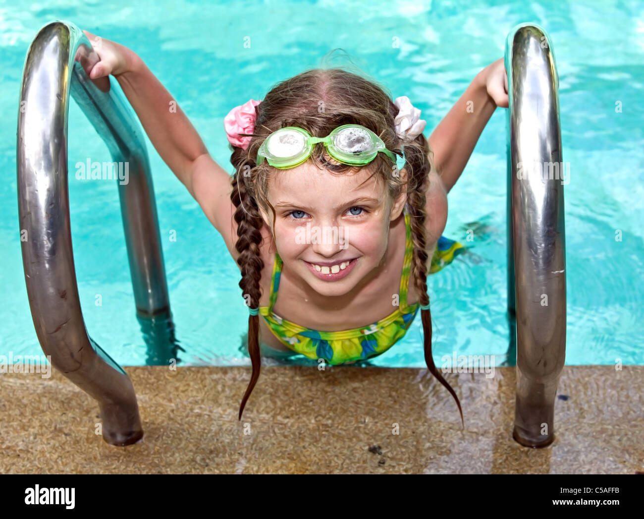 Child in protective goggles swimming pool Stock Photo Alamy
