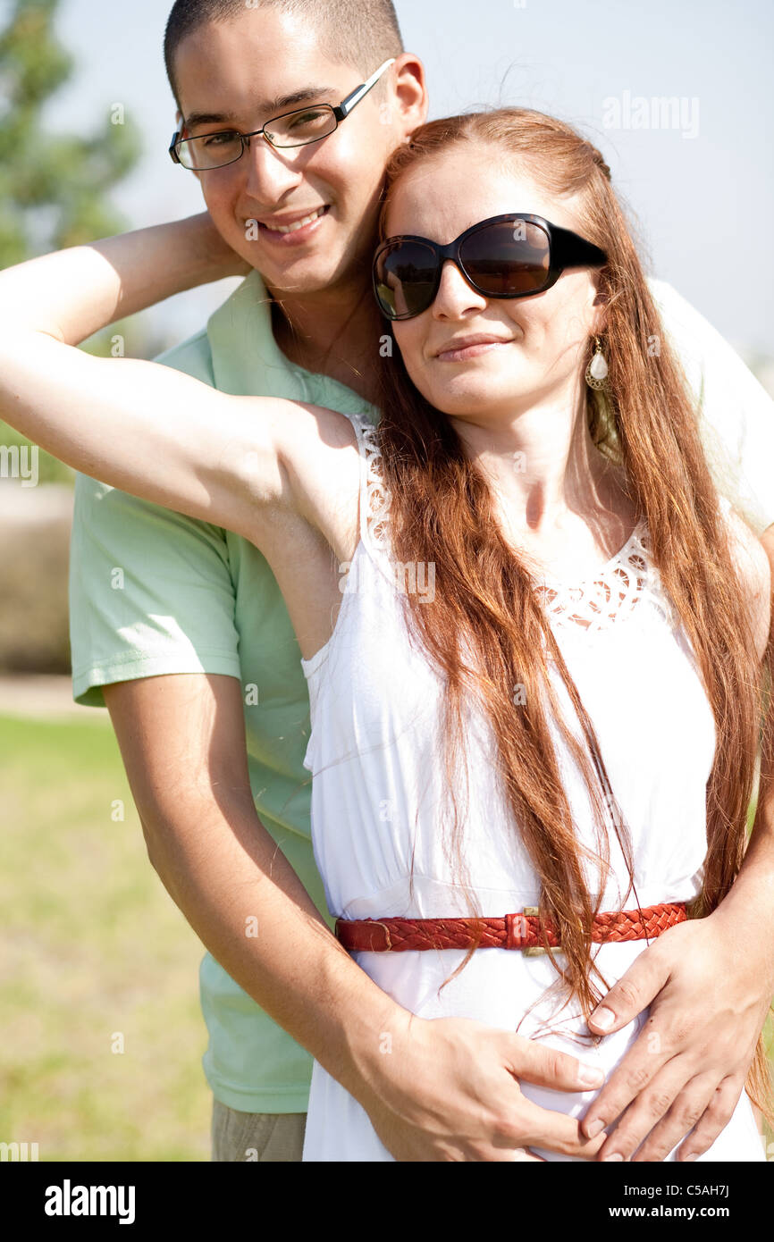 portrait of beautiful young couple hug Stock Photo - Alamy
