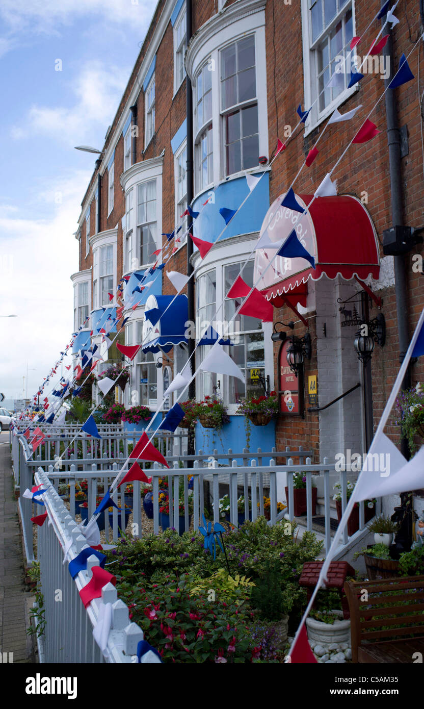 Bunting on the front of guest houses of Weymouth seafront Stock Photo