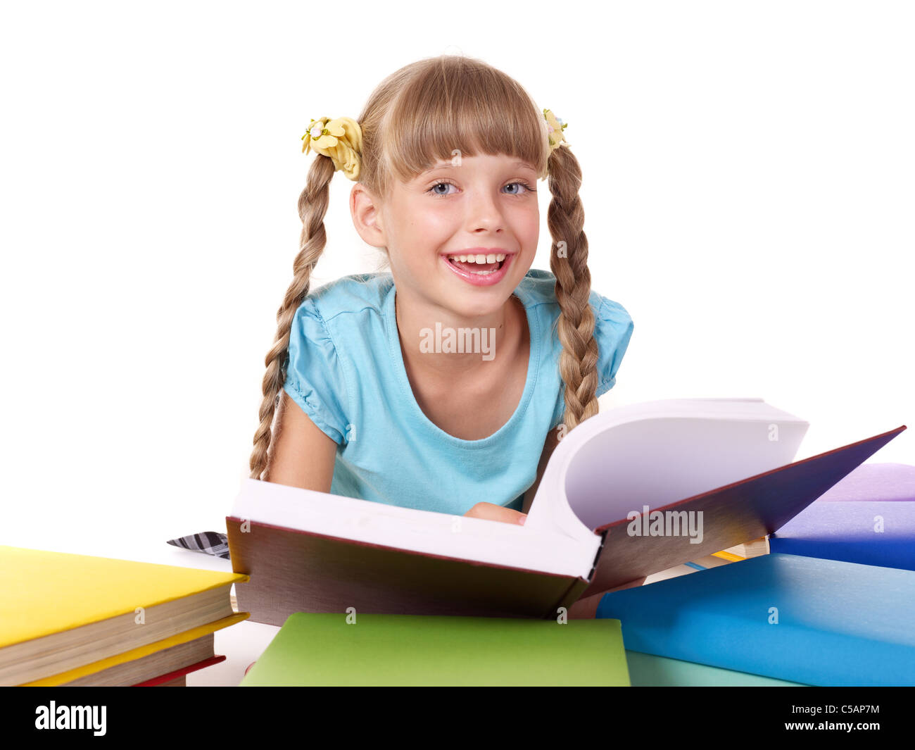 Schoolgirl holding stack of books Stock Photo - Alamy
