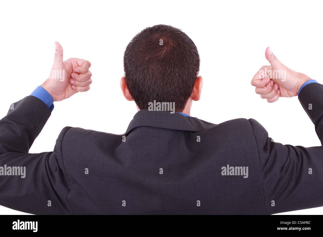 A businessman gives a thumbs up (back) Stock Photo