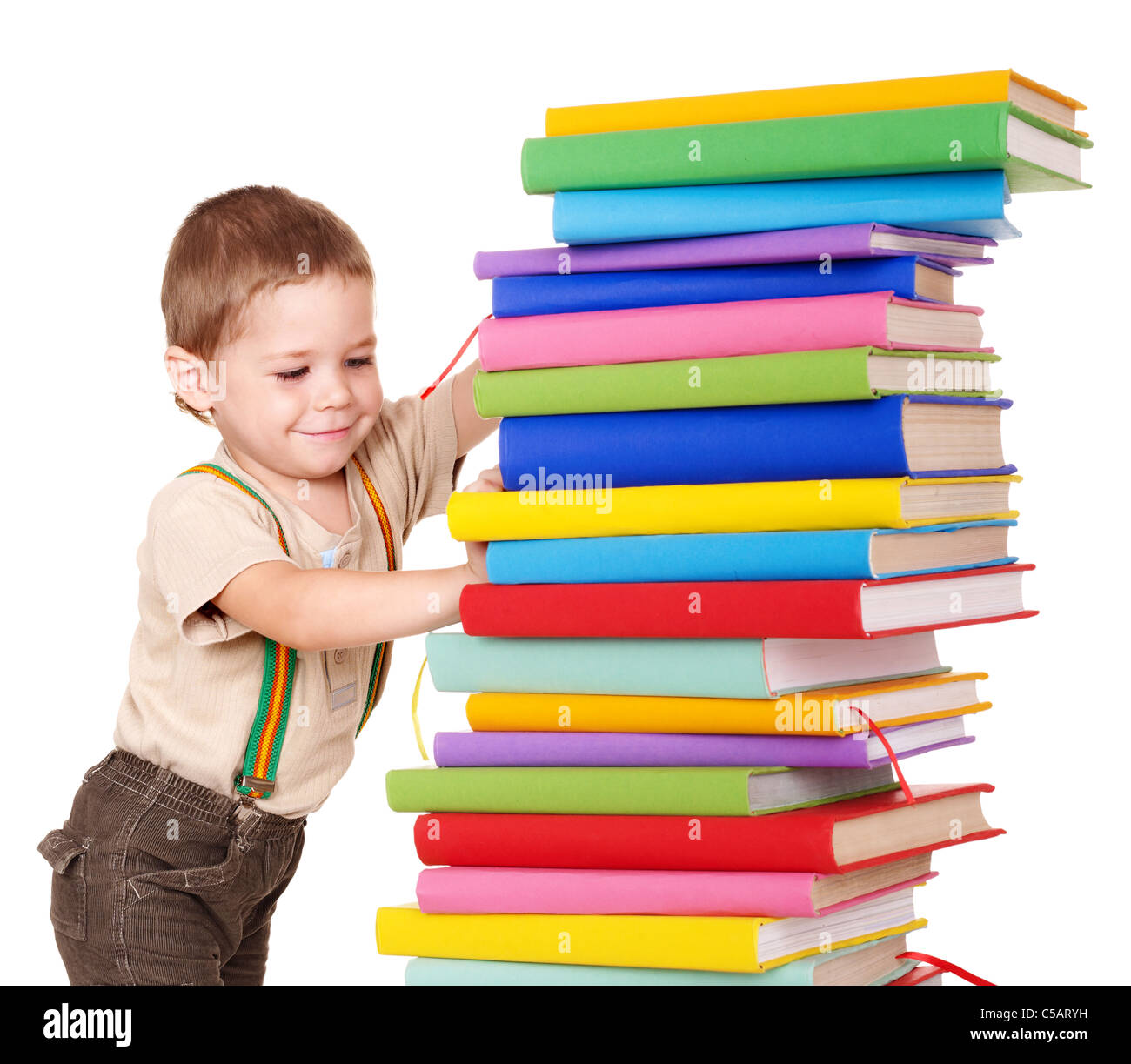 Little boy reading pile of books Stock Photo - Alamy