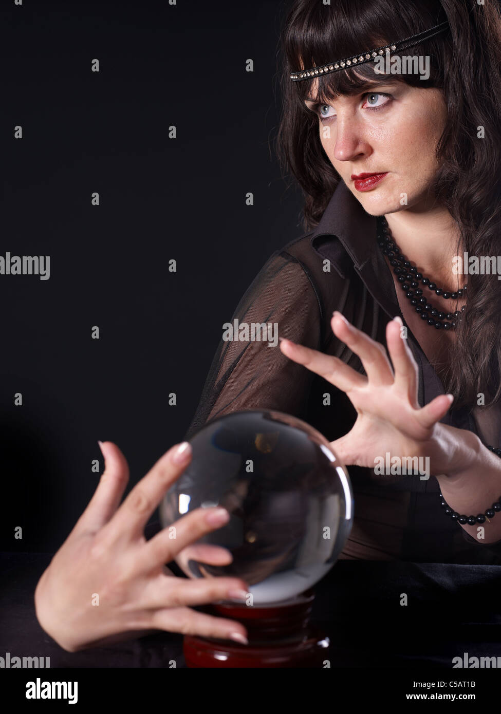 Young woman holding crystal ball Stock Photo Alamy