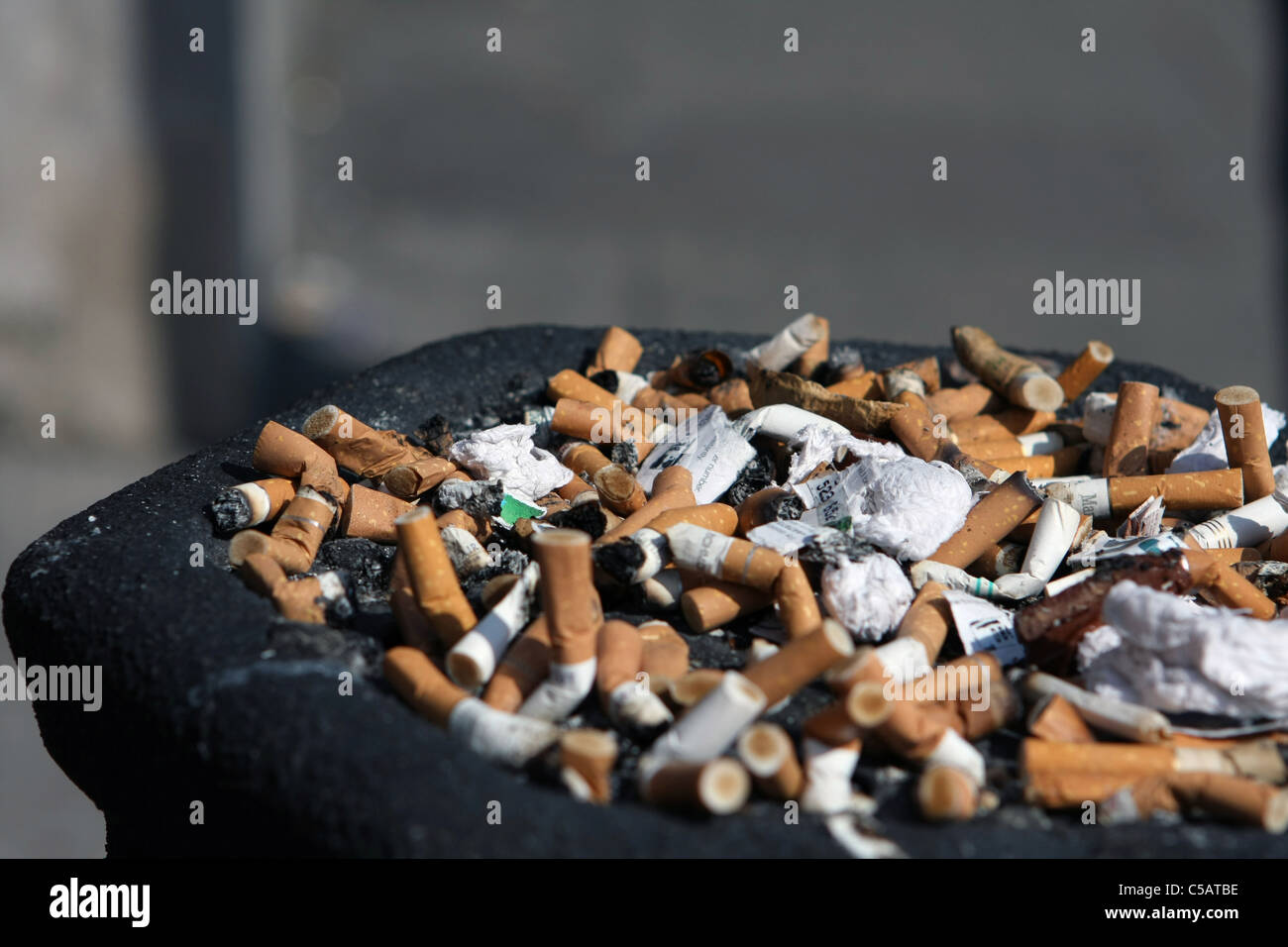 The top of a litter bin full of cigarette ends Stock Photo Alamy