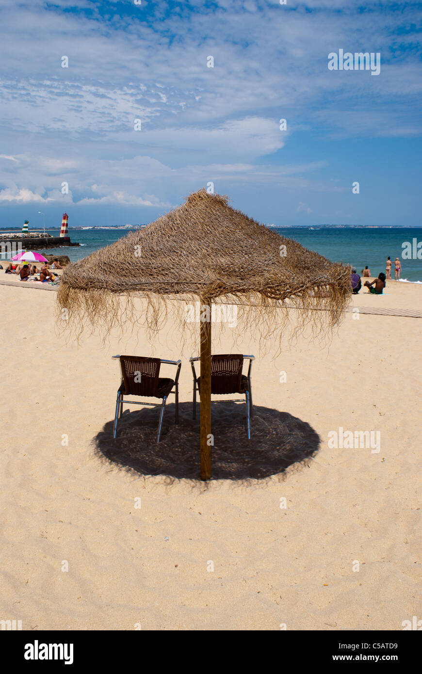 Parasol on a beach in Lagos, Portugal Stock Photo - Alamy