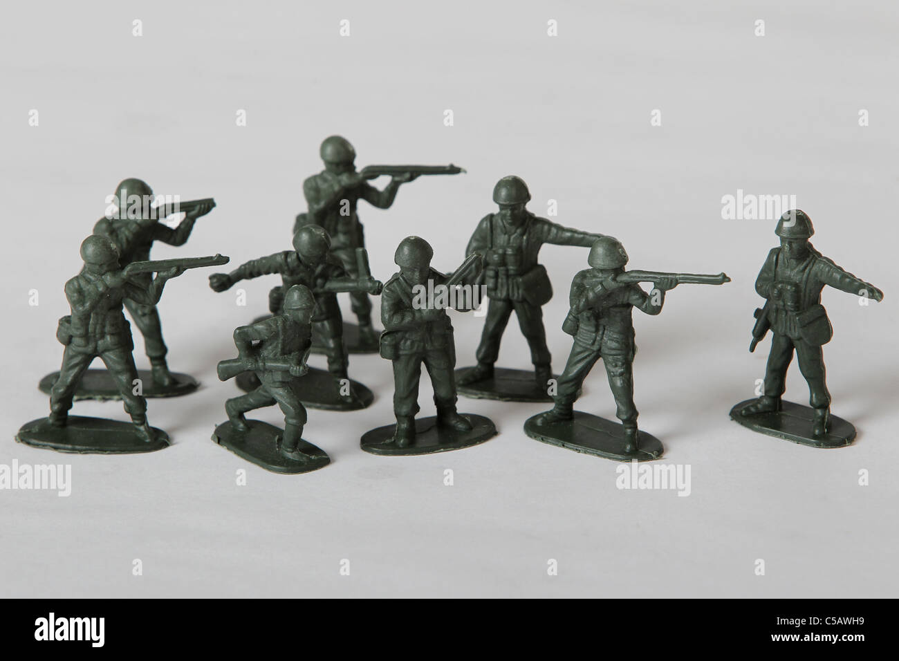 Studio shot of a group of small green plastic toy soldiers. Stock Photo