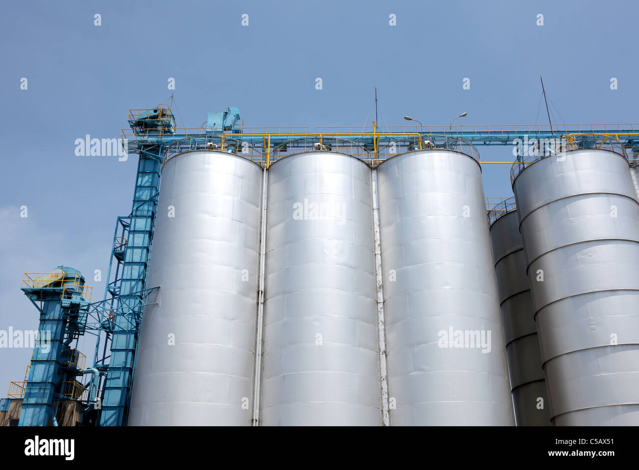 Industrial silo against the blue sky Stock Photo - Alamy