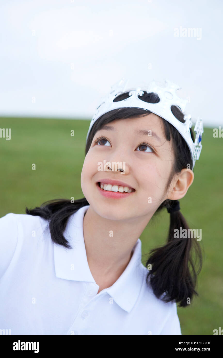 Close-up of girl standing in lawn Stock Photo