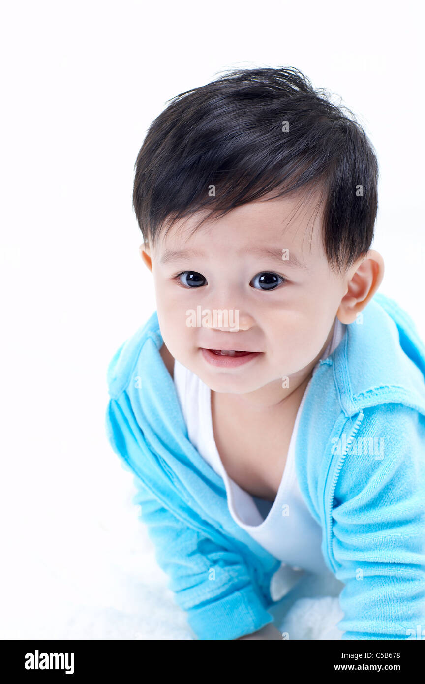 Portrait of Baby boy listening to music Stock Photo - Alamy