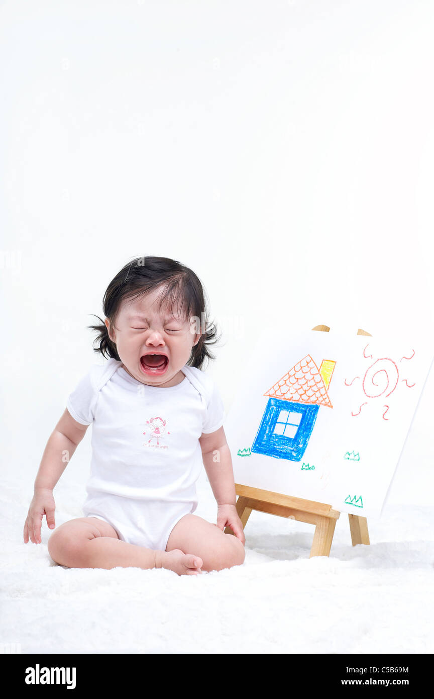 Portrait of Baby boy listening to music Stock Photo - Alamy
