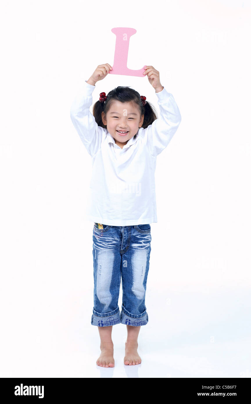 Close-up of children holding text Stock Photo - Alamy