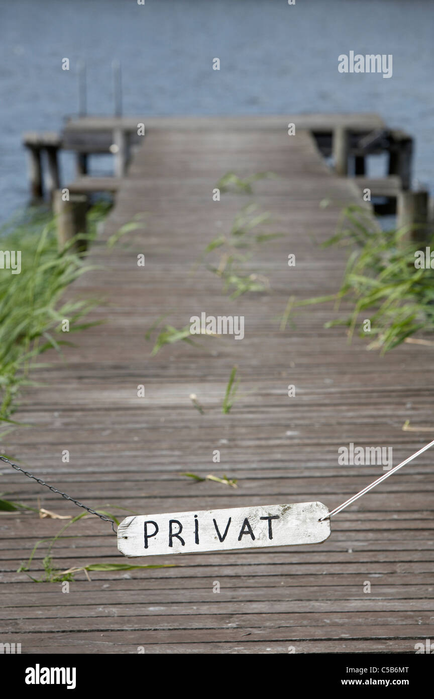 Signboard indicating 'privat' at the private wood paneled jetty Stock Photo