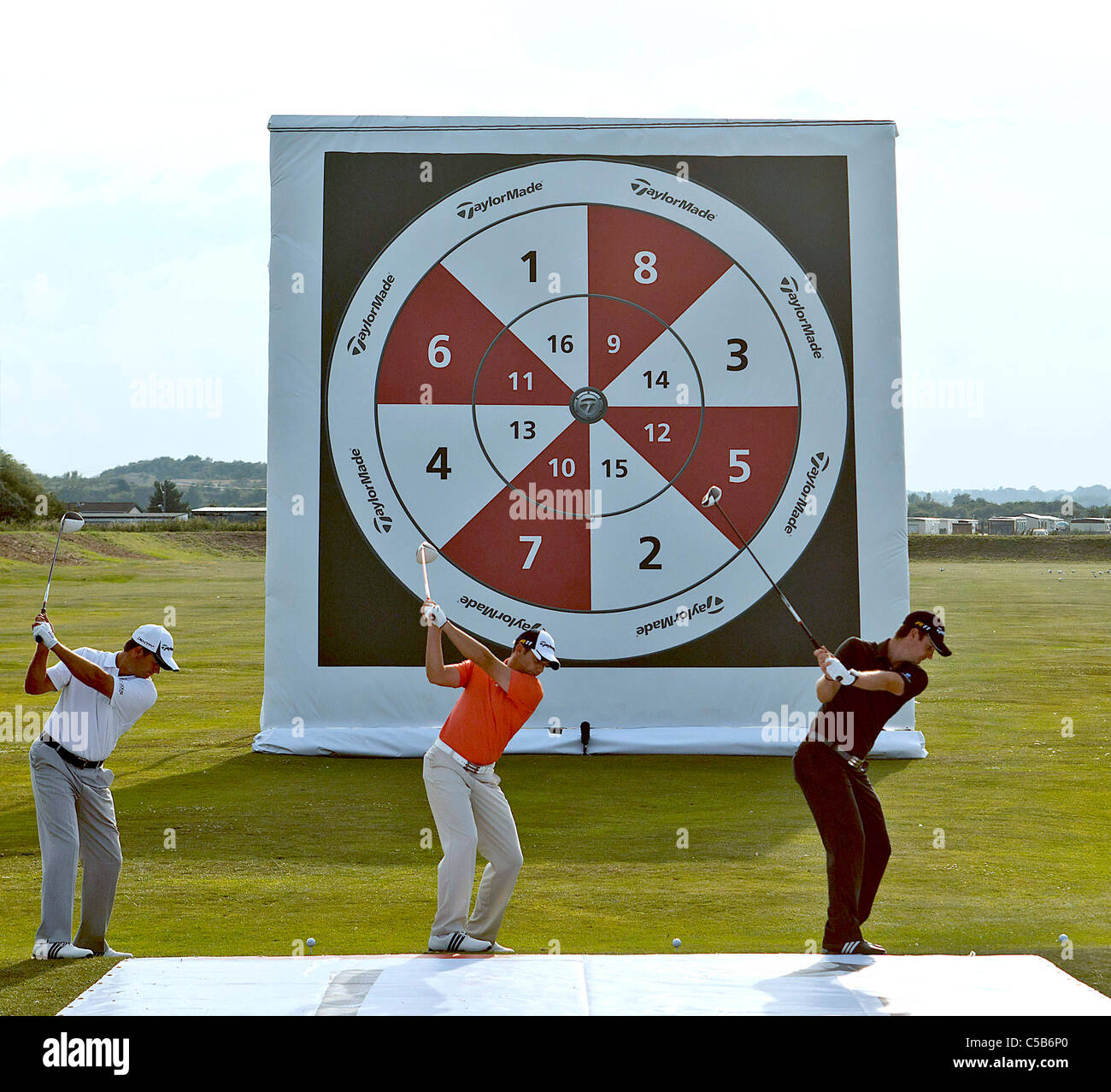 Professionals & celebrities at an evening of Golfing Darts at pre Open