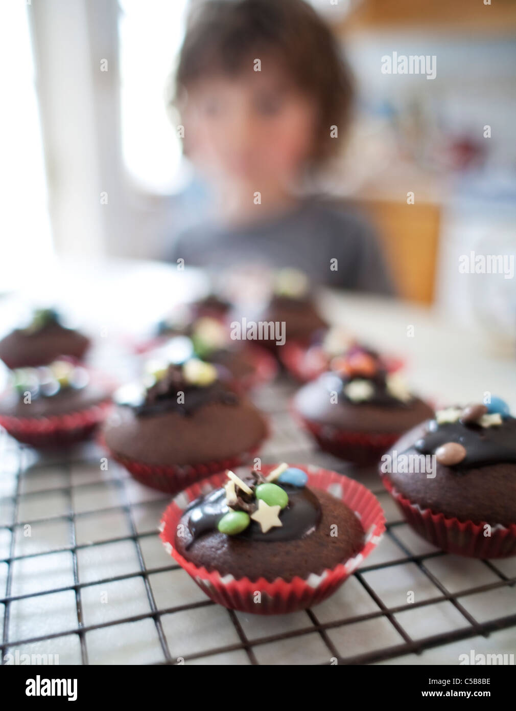 Child with homemade cupcakes Stock Photo