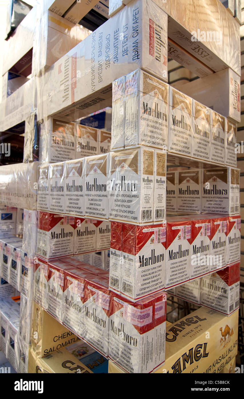 cigarettes in uzbekistan Stacks of Camel and Marlboro cigarettes for sale at market, Uzbekistan  Stock Photo