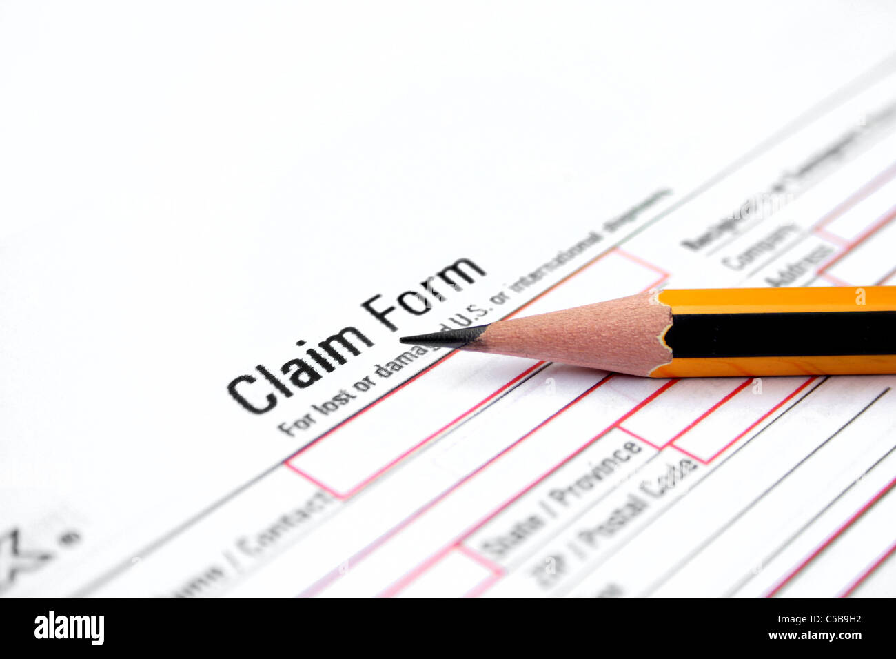 Claim form and pencil Stock Photo - Alamy